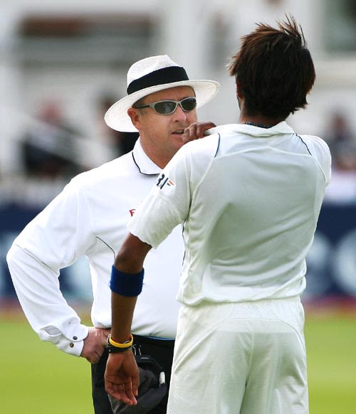 Ian Howell has a word with Sreesanth who shoulder-barged Michael Vaughan