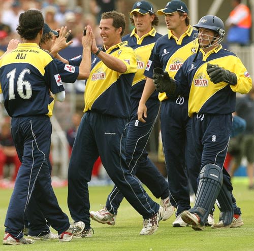 Mark Hardinges and his team-mates celebrate the wicket of Mark Chilton