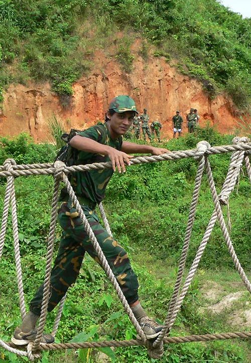 Nadif Chowdhury crosses a hanging bridge