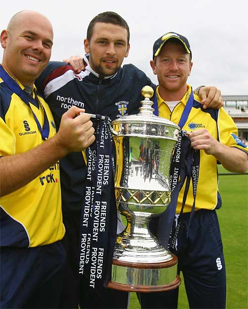 Neil Killeen, Steve Harmison and Paul Collingwood celebrate Durham's first silverware