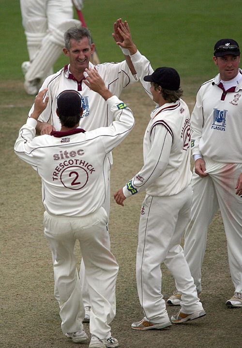 Andrew Caddick is congratulated on one of his three wickets