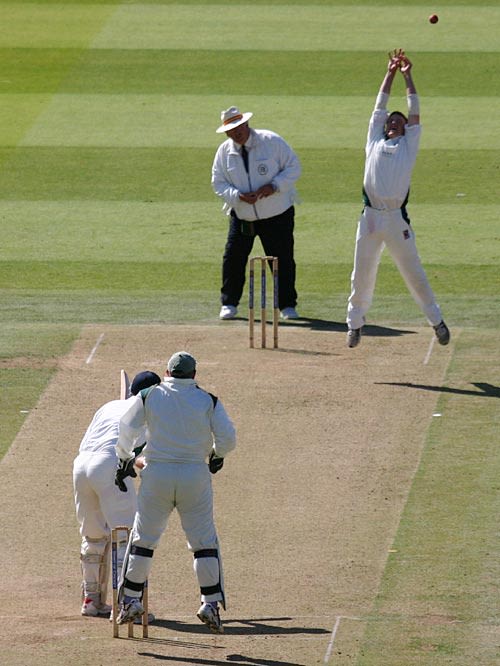 Alan Wells drives inches over the bowler