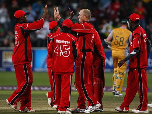 High fives for Gary Brent as Brett Lee heads off