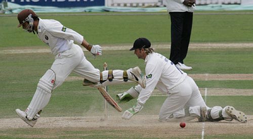 Mark Ramprakash scurries home as Luke Sutton scrambles for the ball