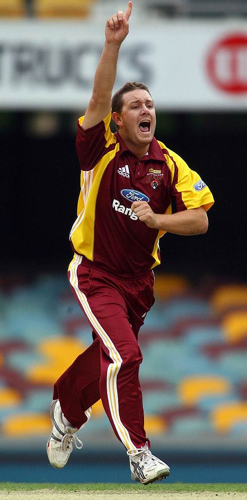 Craig Philipson celebrates taking a wicket with his first ball