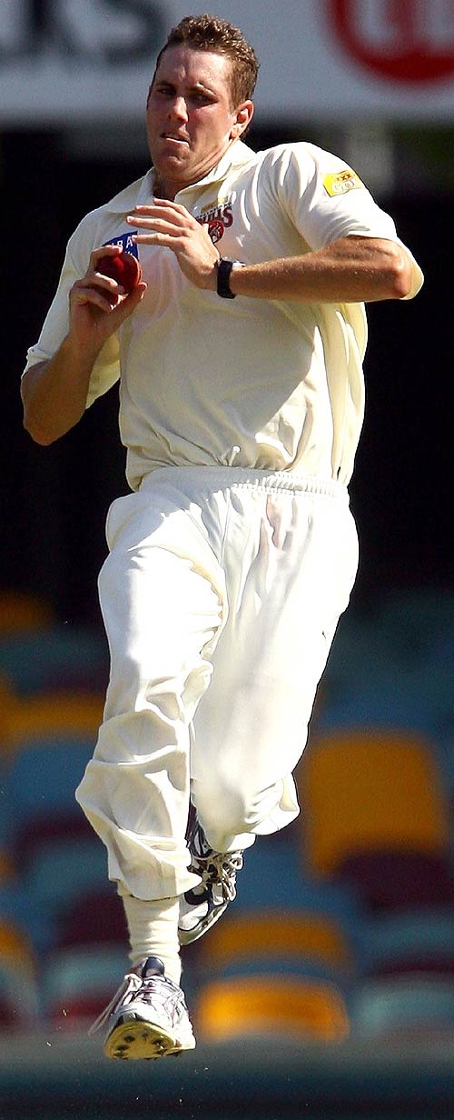 Grant Sullivan runs in to bowl