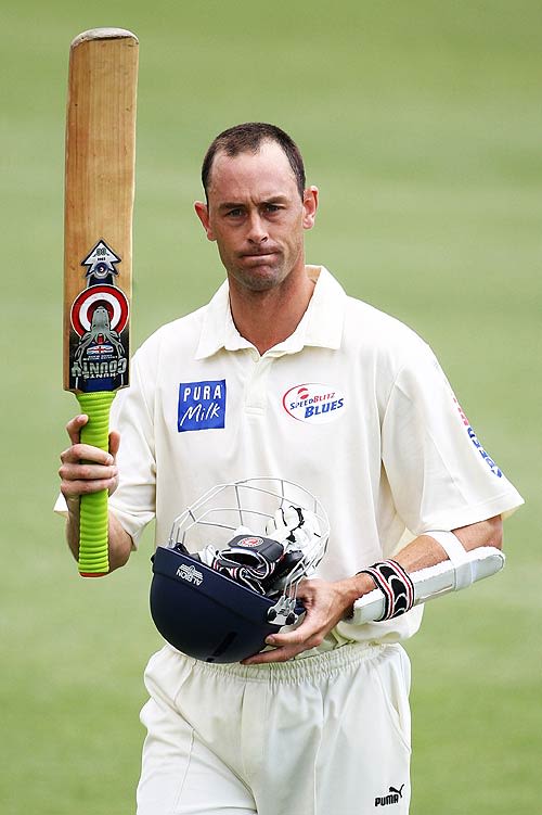 Matthew Nicholson acknowledges the applause after he made 106 not out