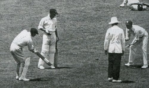Douglas Jardine lobs the ball to Bill Woodfull to get the shine off it