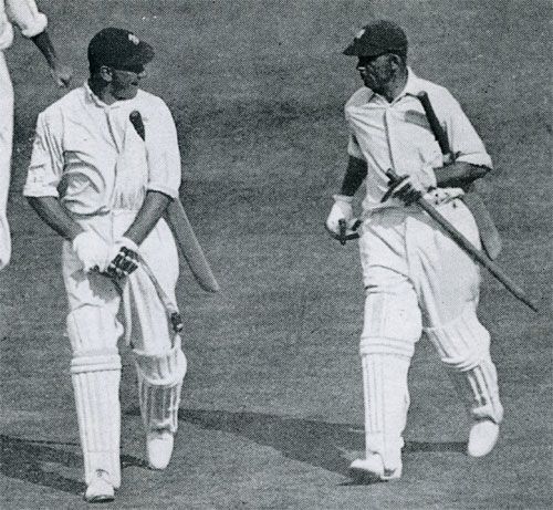 Wally Hammond and Bob Wyatt head off after winning the fifth Test