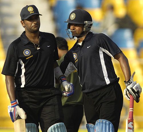 Suresh Raina congratulates Arjun Yadav on his fifty