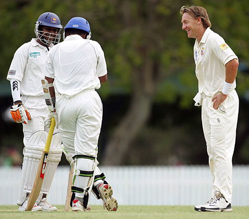 Prasanna Jayawardene and Malinga Bandara share a joke with Andy Bichel