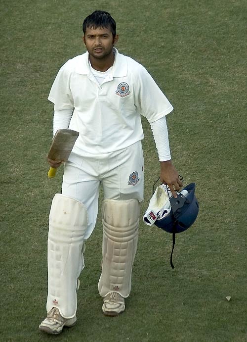 Andhra's Hemal Watekar walks back after scoring his maiden first-class ton