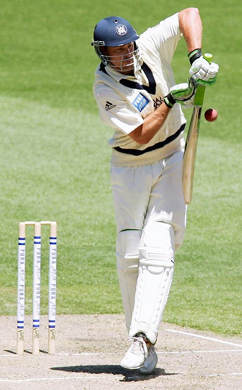 Nick Jewell bunts a short ball into the on side