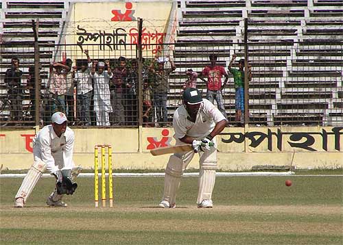 Arafat Salahuddin looks to drive the ball