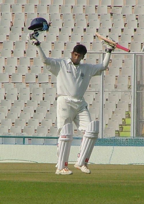 Daniel Manohar celebrates his eighth first-class hundred