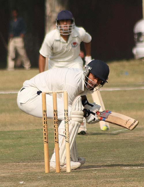 Ian Dev Singh ducks a short ball