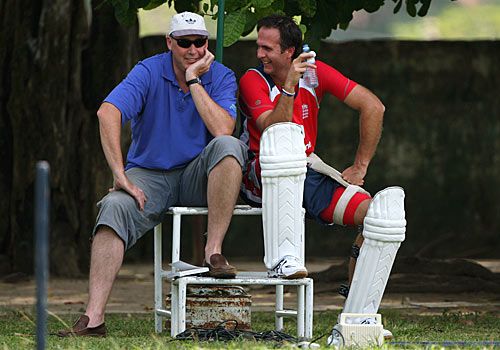 Angus Fraser and Michael Vaughan share a joke during a training session