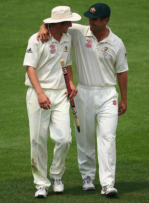 Phil Jaques congratulates Australia's substitute fieldsman Rhett Lockyear after the 96-run victory