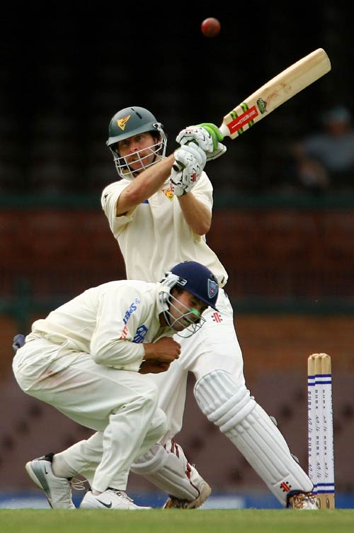 Ed Cowan takes evasive action as Michael Dighton pulls