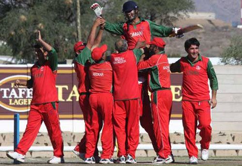 Vaibhav Wategaonkar is hoisted off the field after Oman's two-wicket win over Namibia