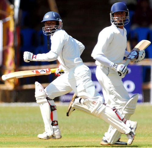 Rajasthan's openers Vineet Saxena and Manish Sharma take a run