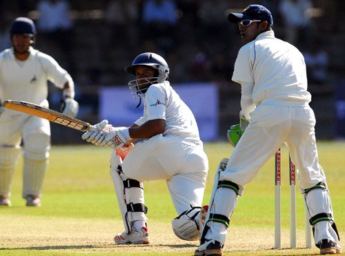 Rajasthan's Rohit Jhalani plays the sweep during his unbeaten 60