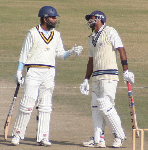 Himachal Pradesh's Sarandeep Singh congratulates Paras Dogra on his fifty