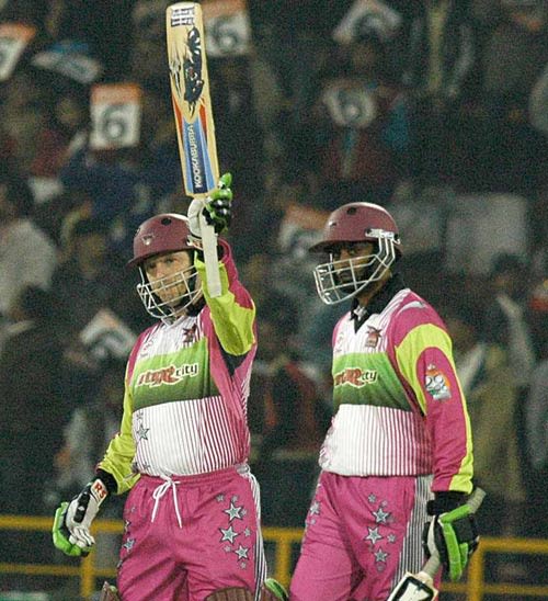 Ian Harvey acknowledges the crowd on reaching his fifty