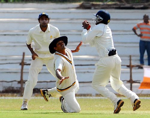Karnatak's KB Pawan latches on to a close-in catch