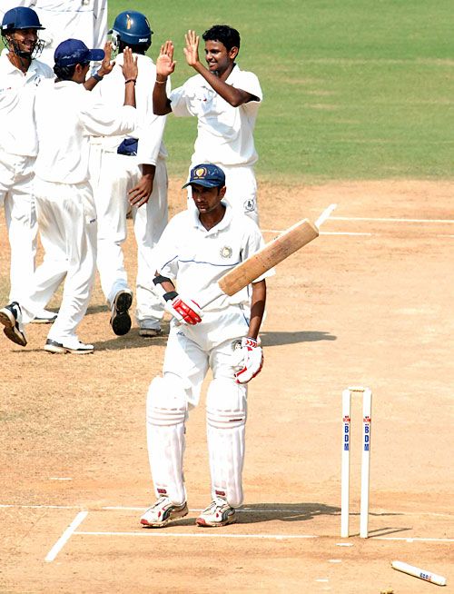 Kanaiya Vaghela walks back after being bowled by Suresh Kumar