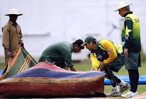 Younis Khan and Talat Ali, Pakistan's manager, take a look at the pitch