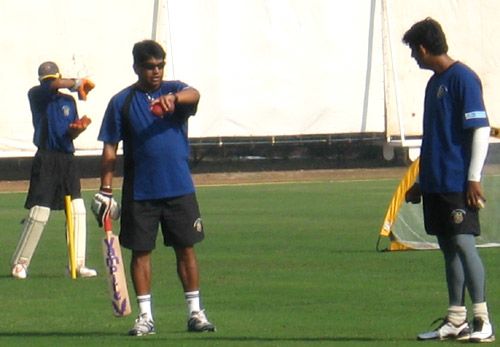 Chandrakant Pandit, the Maharashtra coach, and Sairaj Bahutule have a word during practice