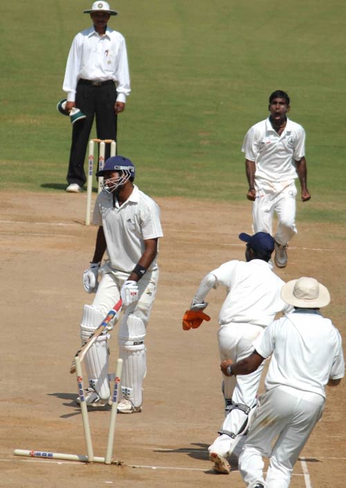 Paras Dogra is stumped off Chinnaswamy Suresh's bowling