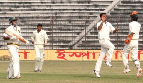 Rajshahi's Mohammad Shahzada and Khaled Mashud celebrate the wicket of Ehsanul Haque
