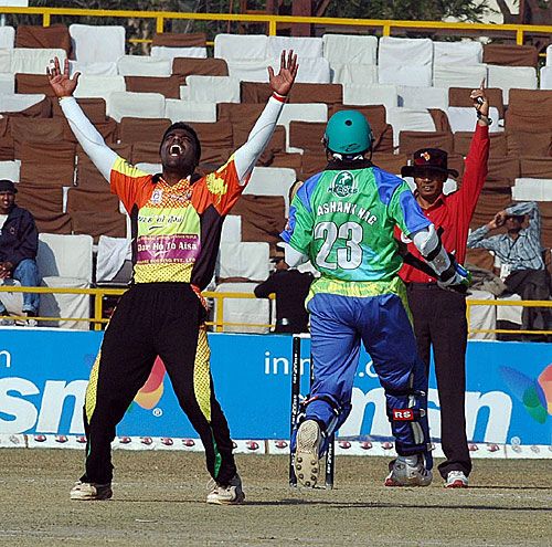 Mumbai Champs' Ranjit Khirid is jubilant after taking Shashank Nag's wicket