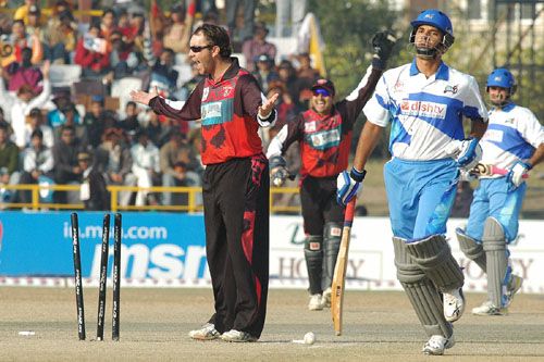 Craig McMillan appeals as Abbas Ali is caught short of his crease