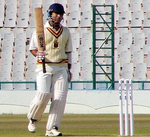 Orissa's Rashmi Parida signals his half-century