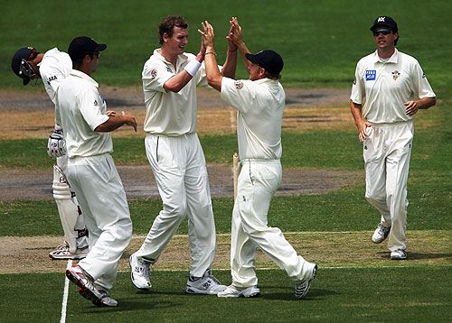 Allan Wise and his Victorian team-mates celebrate