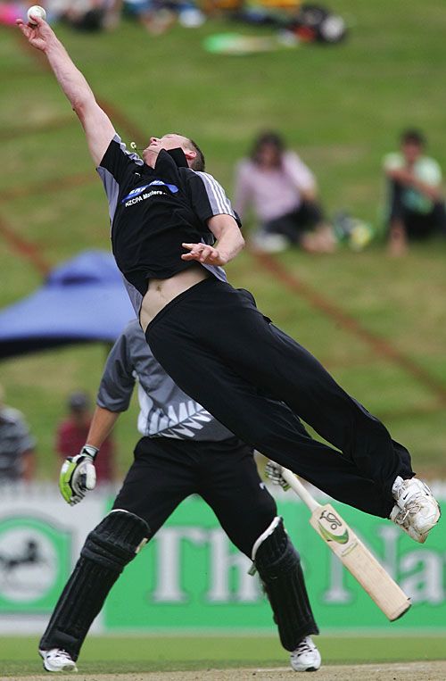 Kerry Walmsley tries to take a catch off his bowling