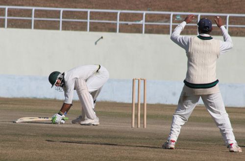 Mukesh Sharma gets into an awkward position after missing a cut shot