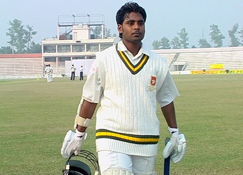 Golam Rahman returns to the pavilion after being dismissed for 45