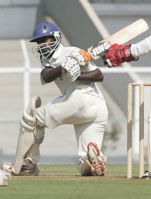 Railways' Harshad Rawle sweeps during his unbeaten 89