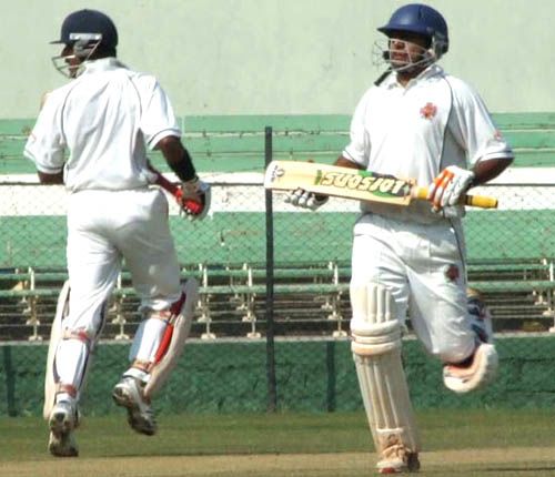 Baroda's Rakesh Solanki and Shatrunjay Gaekwad take a run during their 79-run stand