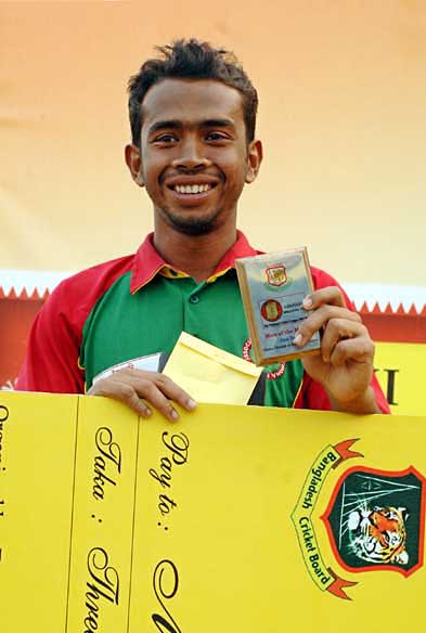 Anwar Hossain collects his Man-of-the-Match award