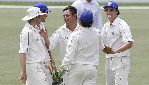 Mark Higgs celebrates removing Virender Sehwag
