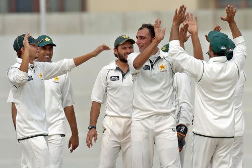 Samiullah Khan celebrates one of his three wickets