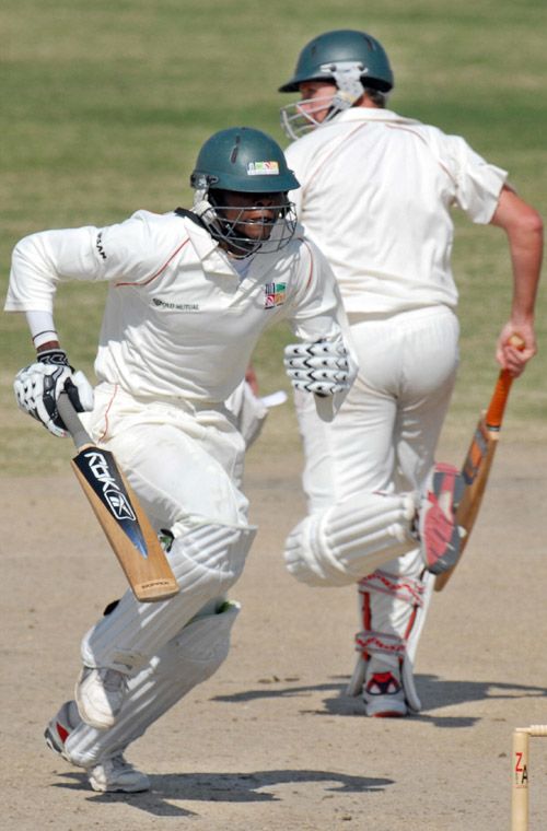 Timycen Maruma and Gary Brent pick up a single during their 86-run eighth-wicket stand