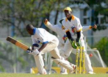 Carlo Morris is deceived by the flight of left-arm spinner Kavesh Kantasingh