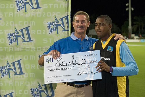 Man-of-the-Match Cletus Mathurin receives his US$25,000 prize money from Allen Stanford