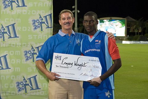 Cayman Islands' receives the Play-of-the-Day award from Allen Stanford